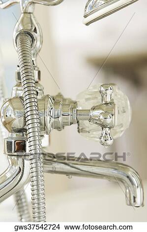 Picture - Close-up of a faucet. Fotosearch