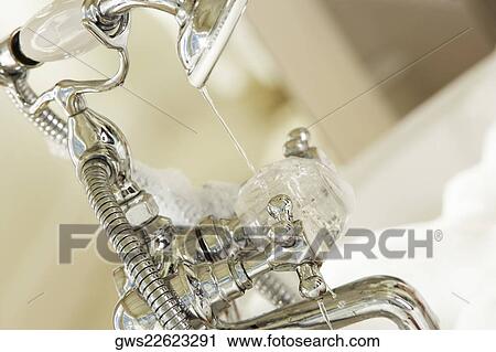 Stock Image - Close-up of a faucet. Fotosearch