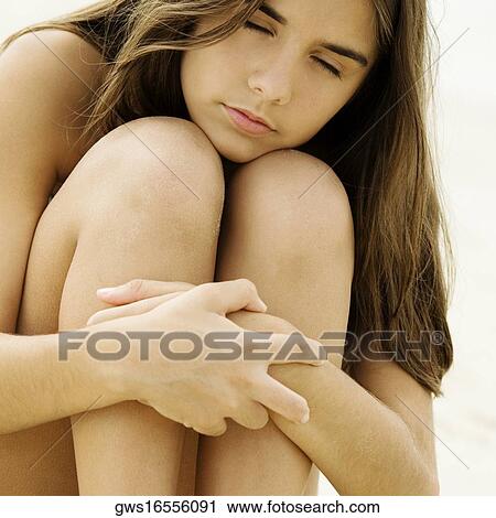Close-up of a girl sitting with her eyes closed View Large Photo Image Stock Image - Close-up of a girl sitting with her eyes closed. Fotosearch