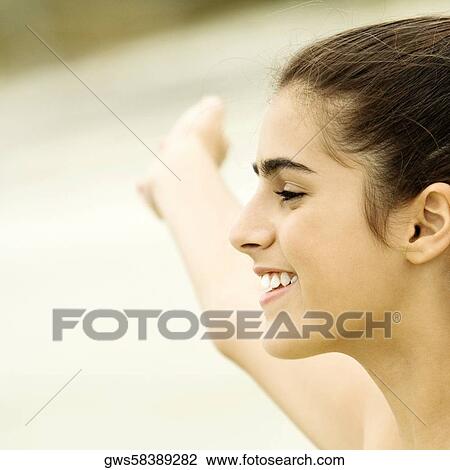 Close-up of a girl smiling View Large Photo Image Stock Image - Close-up of a girl smiling. Fotosearch