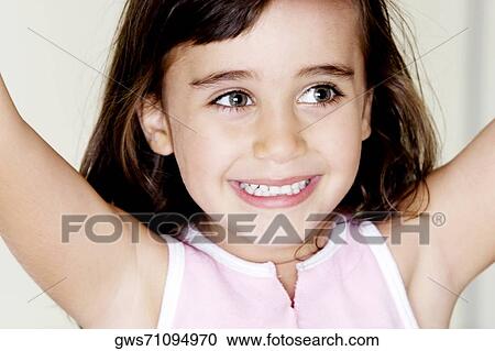 Close-up of a girl smiling View Large Photo Image Stock Image - Close-up of a girl smiling. Fotosearch