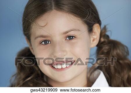 Stock Photo - Close-up of a girl smiling. Fotosearch