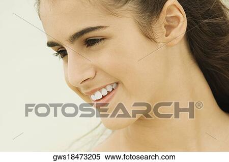 Stock Photography - Close-up of a girl smiling. Fotosearch