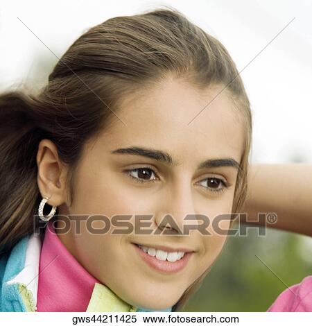 Close-up of a girl smiling View Large Photo Image Stock Photography - Close-up of a girl smiling. Fotosearch