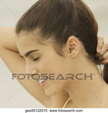 Close-up of a girl smiling with her eyes closed View Large Photo Image Stock Image - Close-up of a girl smiling with her eyes closed. Fotosearch