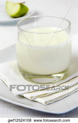Close-up of a glass of milk View Large Photo Image Stock Photo - Close-up of a glass of milk. Fotosearch