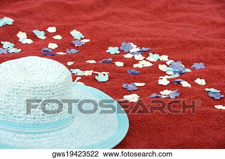 Close-up of a hat with artificial flowers on a picnic blanket View Large Photo Image Stock Image - Close-up of a hat with artificial flowers on a picnic blanket. Fotosearch
