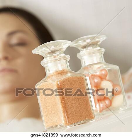 Close-up of a herbal medicine and pearls in a jar View Large Photo Image Stock Photo - Close-up of a herbal medicine and pearls in a jar. Fotosearch