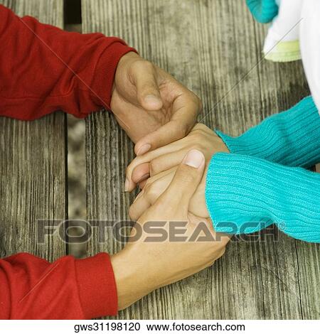 Close-up of a man holding a woman's hand View Large Photo Image Stock Image - Close-up of a man holding a woman's hand. Fotosearch