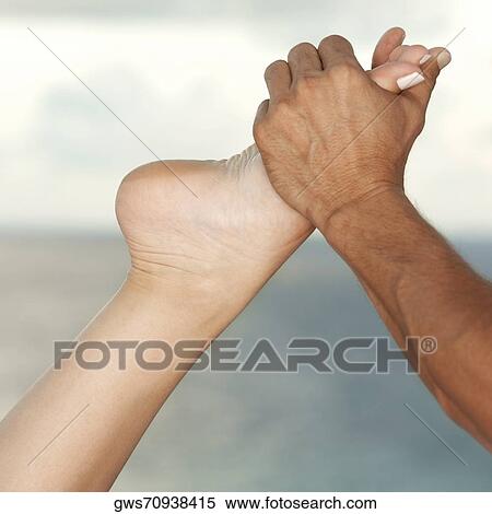 Close-up of a man massaging a person's foot View Large Photo Image Stock Photography - Close-up of a man massaging a person's foot. Fotosearch