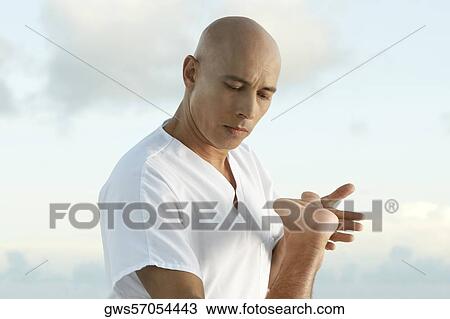 Close-up of a mature man holding a person's leg View Large Photo Image Stock Image - Close-up of a mature man holding a person's leg. Fotosearch