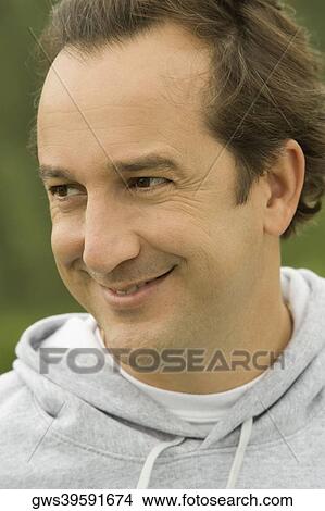 Close-up of a mature man looking away View Large Photo Image Picture - Close-up of a mature man looking away. Fotosearch