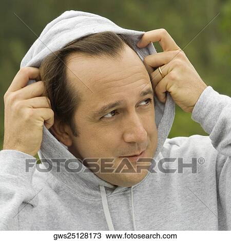 Close-up of a mature man looking away View Large Photo Image Stock Image - Close-up of a mature man looking away. Fotosearch