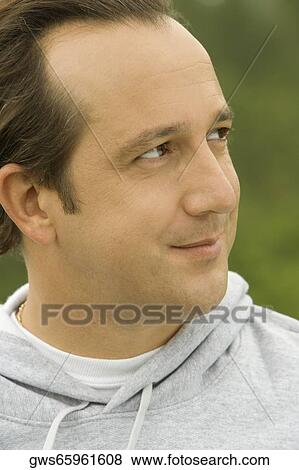 Close-up of a mature man looking away View Large Photo Image Stock Photo - Close-up of a mature man looking away. Fotosearch