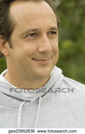 Close-up of a mature man looking away View Large Photo Image Stock Photograph - Close-up of a mature man looking away. Fotosearch