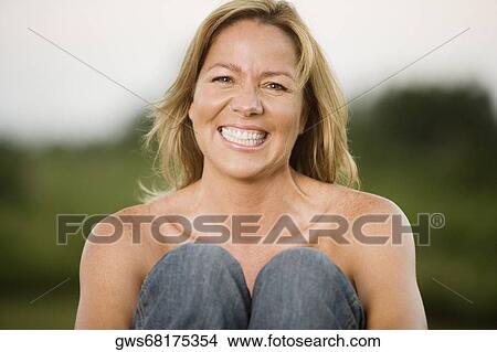 Close-up of a mature woman grinning View Large Photo Image Picture - Close-up of a mature woman grinning. Fotosearch