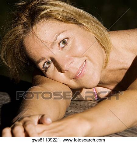 Stock Image - Close-up of a mature woman smiling. Fotosearch