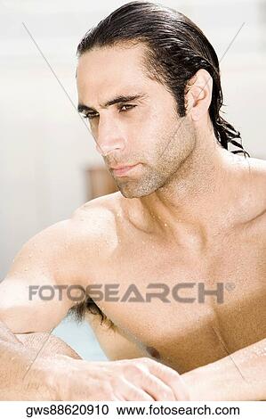Close-up of a mid adult man looking serious View Large Photo Image Stock Image - Close-up of a mid adult man looking serious. Fotosearch