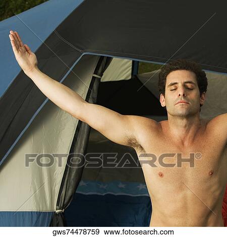 Stock Photo - Close-up of a mid adult man meditating with his eyes closed. Fotosearch