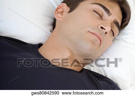 Close-up of a mid adult man sleeping View Large Photo Image Stock Image - Close-up of a mid adult man sleeping. Fotosearch