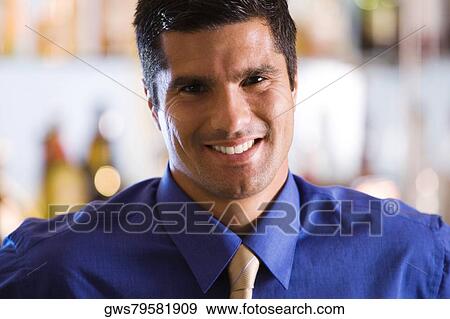 Stock Photo - Close-up of a mid adult man smiling. Fotosearch