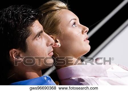 Stock Photo - Close-up of a mid adult man with a young woman. Fotosearch