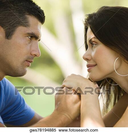 Close-up of a mid adult man with a young woman holding hands View Large Photo Image Stock Photography - Close-up of a mid adult man with a young woman holding hands. Fotosearch