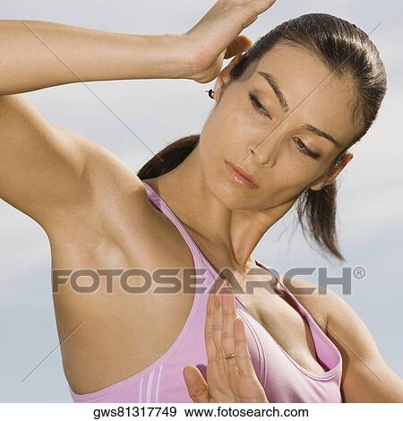Close-up of a mid adult woman exercising View Large Photo Image Stock Photo - Close-up of a mid adult woman exercising. Fotosearch