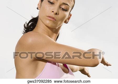 Close-up of a mid adult woman exercising View Large Photo Image Stock Photography - Close-up of a mid adult woman exercising. Fotosearch