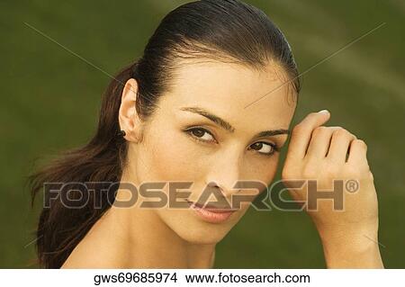 Close-up of a mid adult woman looking sideways View Large Photo Image Picture - Close-up of a mid adult woman looking sideways. Fotosearch
