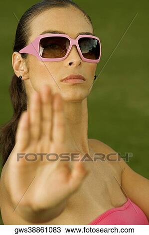 Close-up of a mid adult woman showing a stop gesture View Large Photo Image Stock Image - Close-up of a mid adult woman showing a stop gesture. Fotosearch