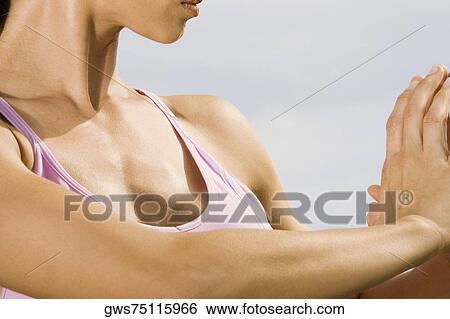 Close-up of a mid adult woman practicing martial arts View Large Photo Image Stock Photograph - Close-up of a mid adult woman practicing martial arts. Fotosearch