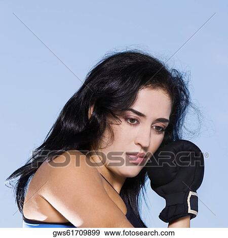 Stock Photo - Close-up of a mid adult woman thinking. Fotosearch
