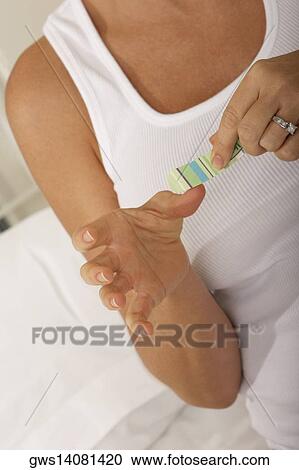 Close-up of a mid adult woman using a nail file View Large Photo Image Stock Image - Close-up of a mid adult woman using a nail file. Fotosearch