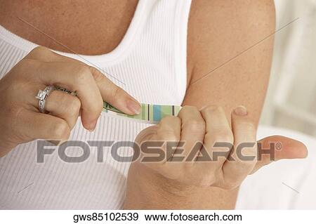 Close-up of a mid adult woman using a nail file View Large Photo Image Stock Photo - Close-up of a mid adult woman using a nail file. Fotosearch