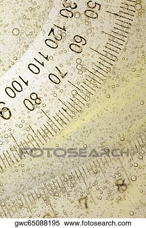 Close-up of a protractor and a ruler in water View Large Photo Image Stock Photography - Close-up of a protractor and a ruler in water. Fotosearch