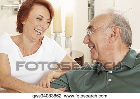 Close-up of a senior couple looking at each other View Large Photo Image Stock Image - Close-up of a senior couple looking at each other. Fotosearch
