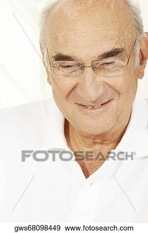 Close-up of a senior man smiling View Large Photo Image Stock Photo - Close-up of a senior man smiling. Fotosearch