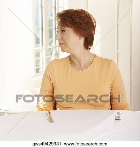 Close-up of a senior woman looking sideways View Large Photo Image Stock Image - Close-up of a senior woman looking sideways. Fotosearch