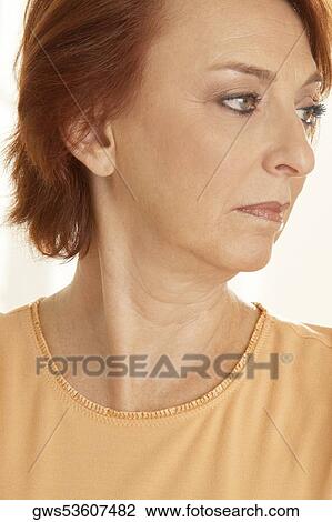Close-up of a senior woman looking sideways View Large Photo Image Stock Image - Close-up of a senior woman looking sideways. Fotosearch