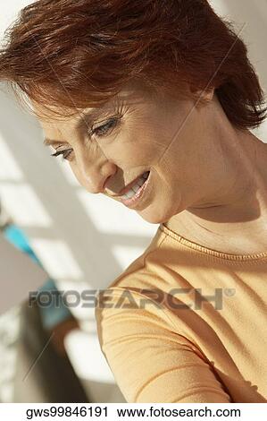 Close-up of a senior woman smiling View Large Photo Image Stock Image - Close-up of a senior woman smiling. Fotosearch