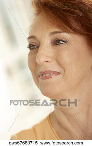 Close-up of a senior woman smiling View Large Photo Image Stock Photography - Close-up of a senior woman smiling. Fotosearch