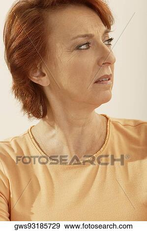 Stock Photo - Close-up of a senior woman thinking. Fotosearch