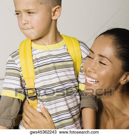 Stock Image - Close-up of a son and his mother laughing. Fotosearch