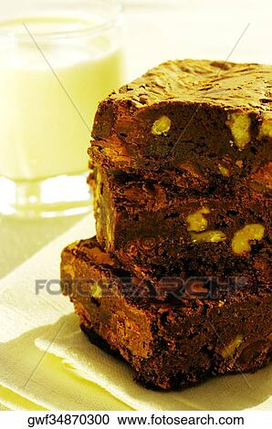 Close-up of a stack of brownies and a glass of milk View Large Photo Image Stock Image - Close-up of a stack of brownies and a glass of milk. Fotosearch