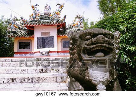Close-up of a statue in front of a tomb, Ishigaki, Okinawa, Japan View Large Photo Image Stock Photo - Close-up of a statue in front of a tomb, Ishigaki, Okinawa, Japan. Fotosearch