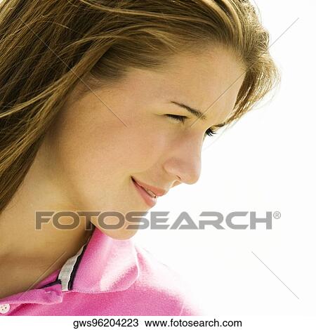 Close-up of a teenage girl looking sideways View Large Photo Image Stock Image - Close-up of a teenage girl looking sideways. Fotosearch