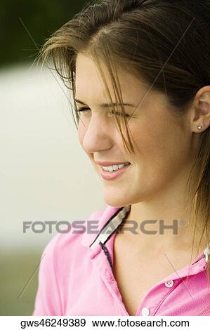 Close-up of a teenage girl smiling View Large Photo Image Stock Photo - Close-up of a teenage girl smiling. Fotosearch