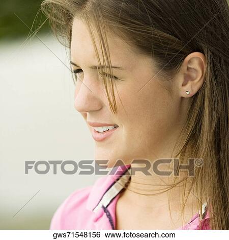 Stock Photograph - Close-up of a teenage girl smiling. Fotosearch