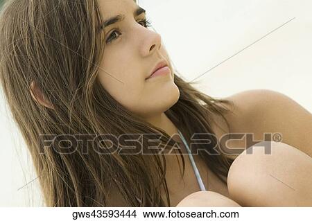 Picture - Close-up of a teenage girl thinking. Fotosearch